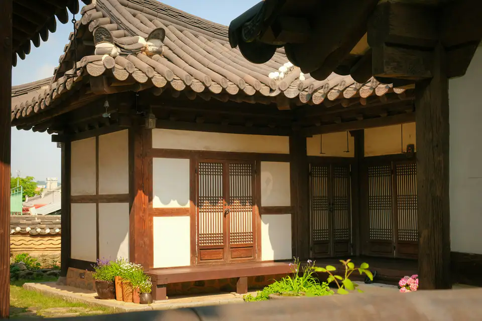 A hanok with a wooden bench in front — Hanok, Jeonju