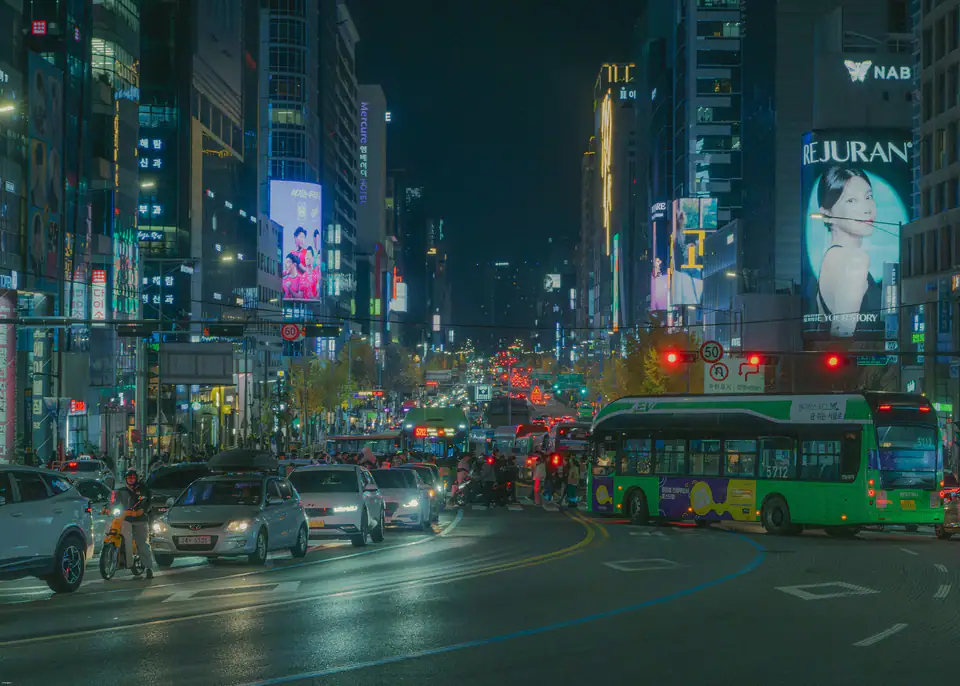A busy street by Hongik University station at night — Hongdae, Seoul